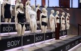 A display of mannequins wearing various styles and colours of underwear and lingerie stands on tiered platforms labelled BODY and M&S in a modern, well-lit showroom.